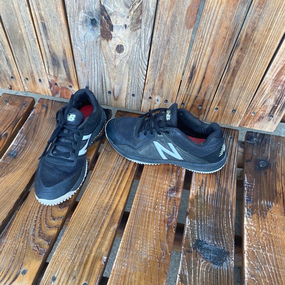 Mens turf shoes NB worn only a few times. Black and white in color size 8.5